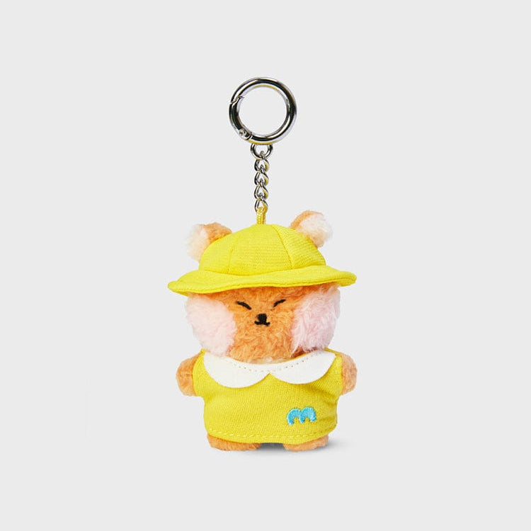 Plush fox keychain wearing a yellow outfit and hat.