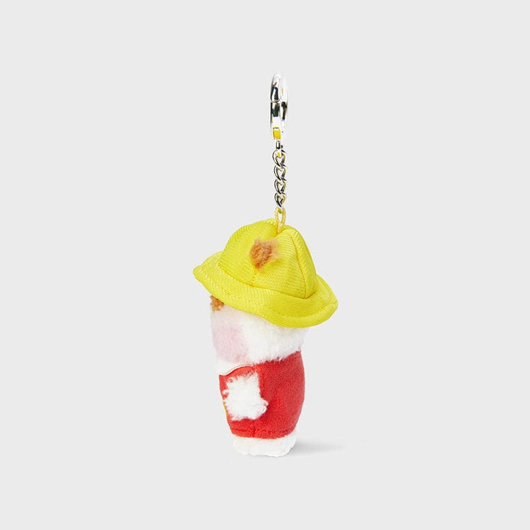 Stuffed keychain wearing a yellow hat and red shirt.