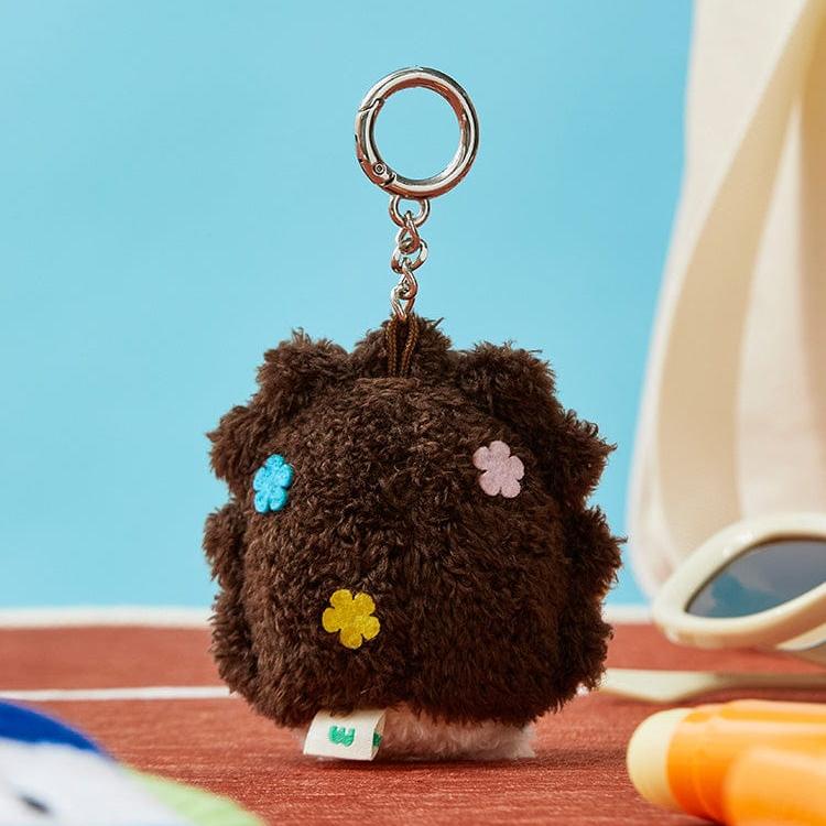 Brown, plush, flower-decorated key chain.