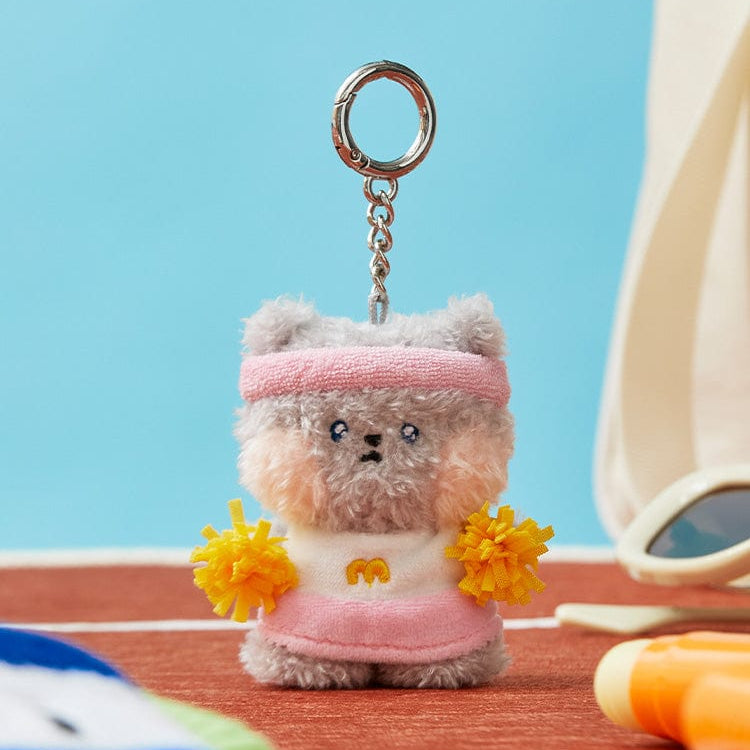 Plush keychain with pink headband and cheerleader uniform.