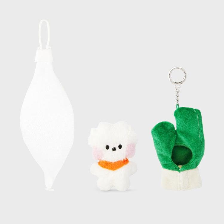 A white fabric bulb ornament, a small white stuffed dog with an orange scarf, and a green and white glove keychain.