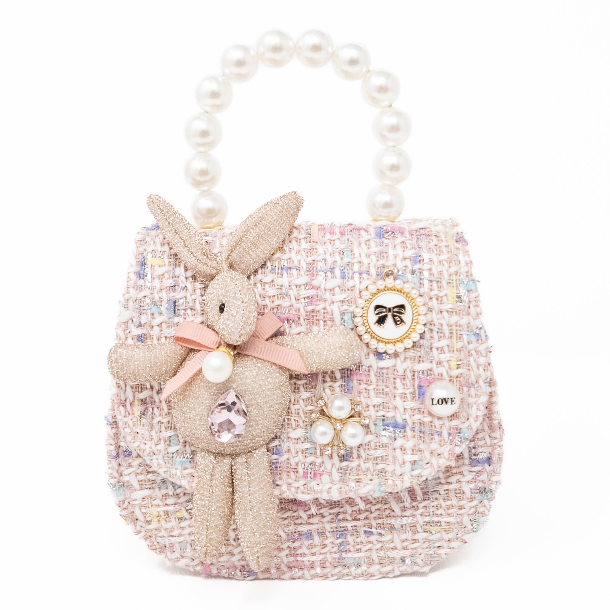 Pink tweed purse with bunny and pearl embellishments.