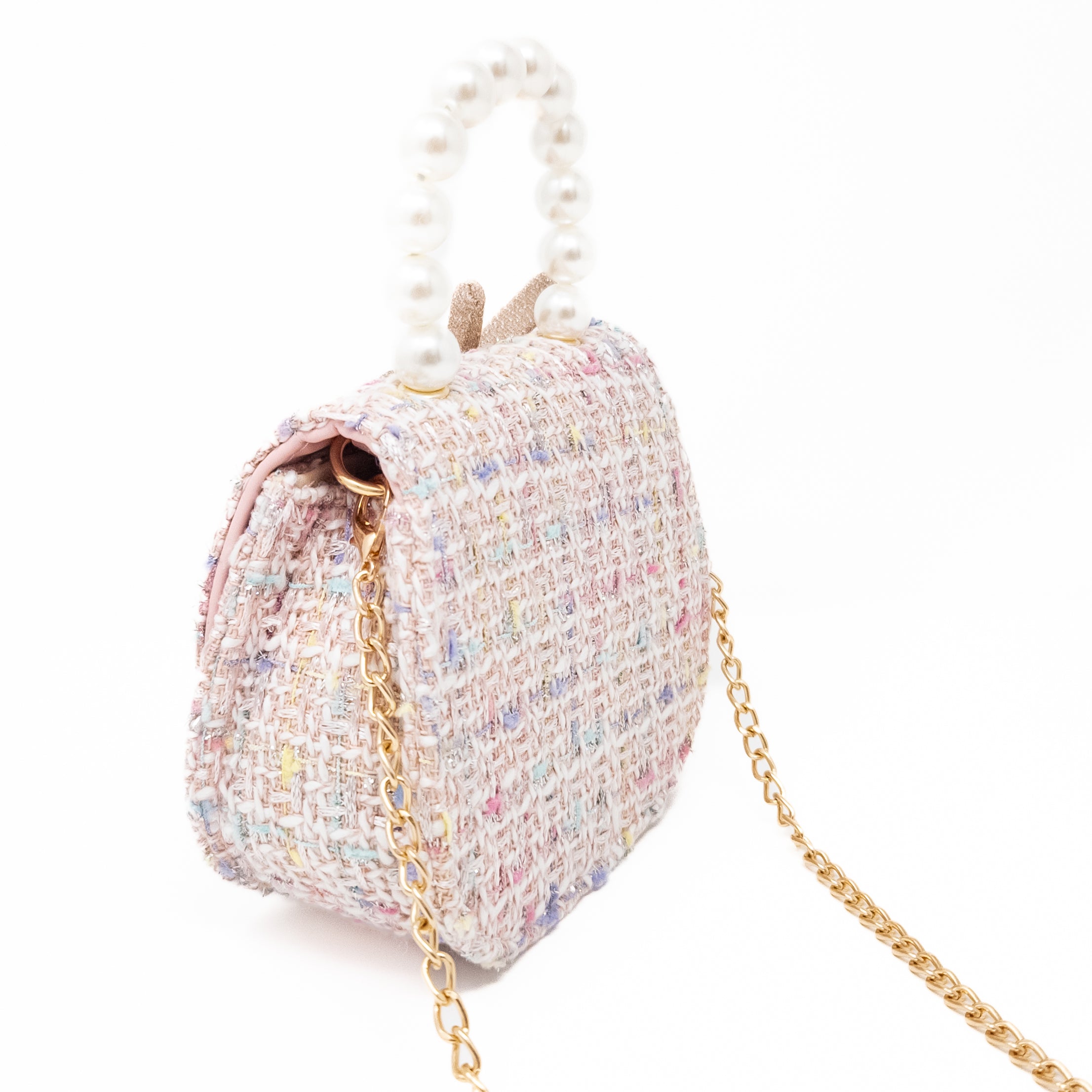 Textured tweed handbag with pearl handle and gold chain strap.