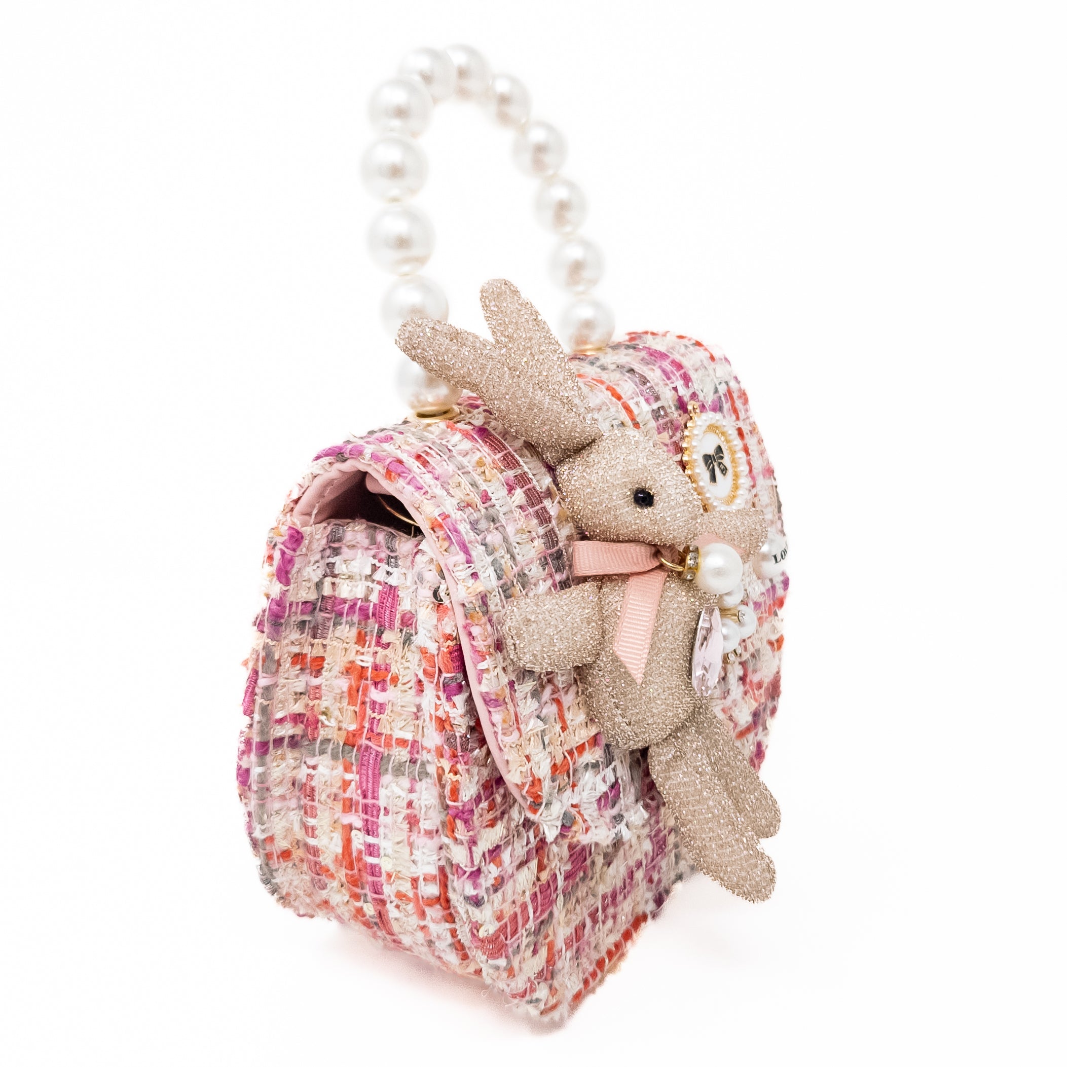 Tweed purse with a bunny embellishment and pearl handle.