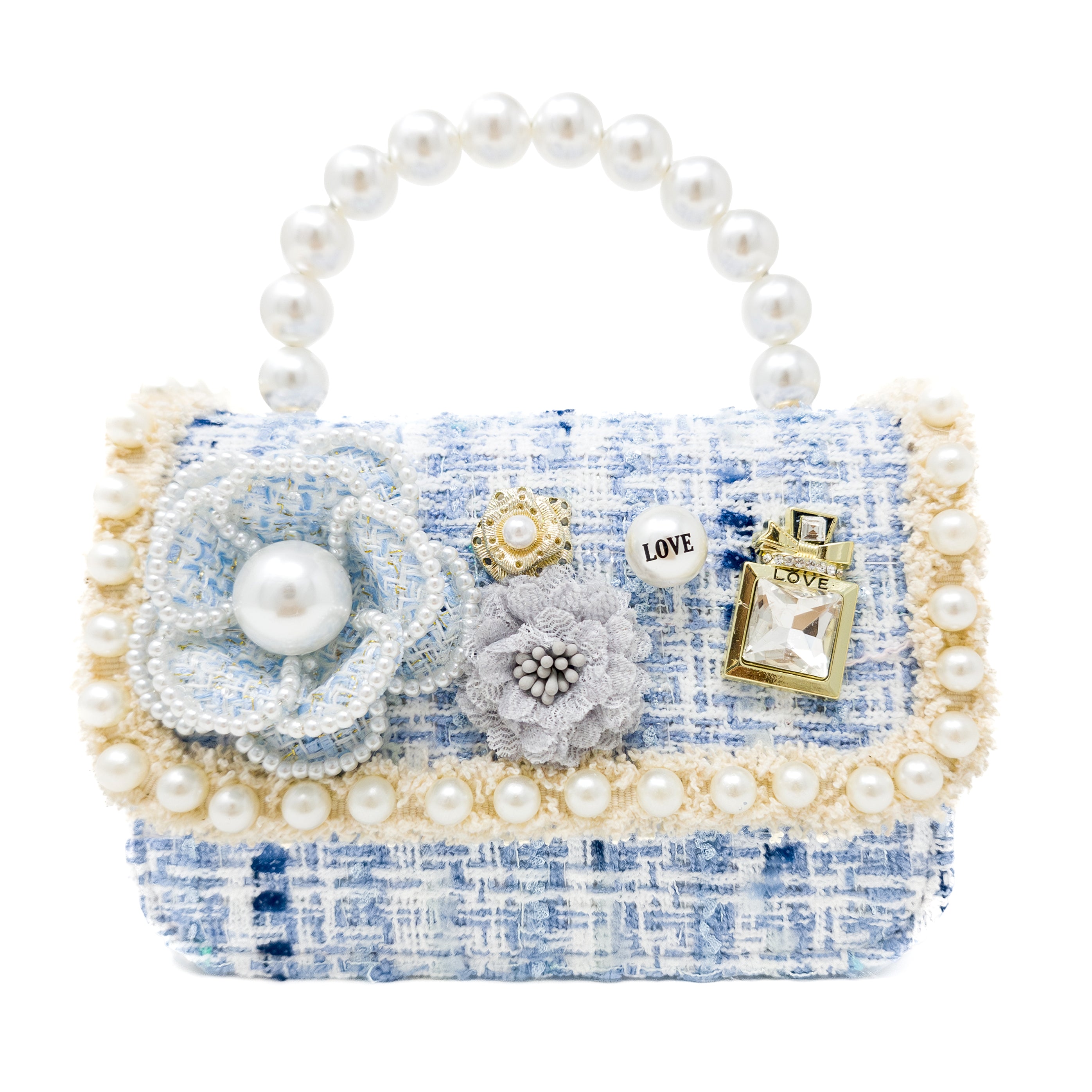 Decorative handbag with pearls, flowers, and a perfume bottle charm on a white background