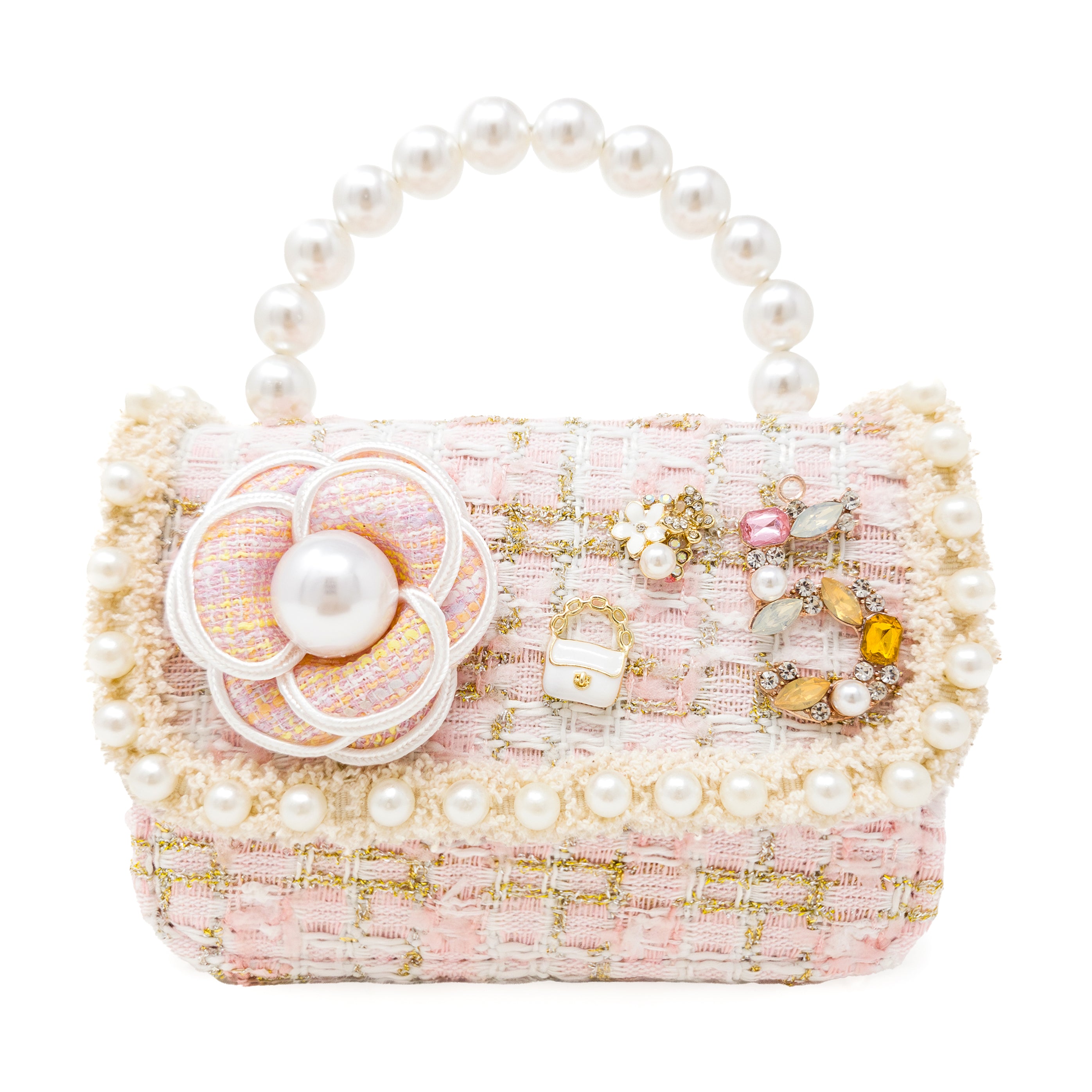 Pink handbag with floral design and pearl embellishments on a white background