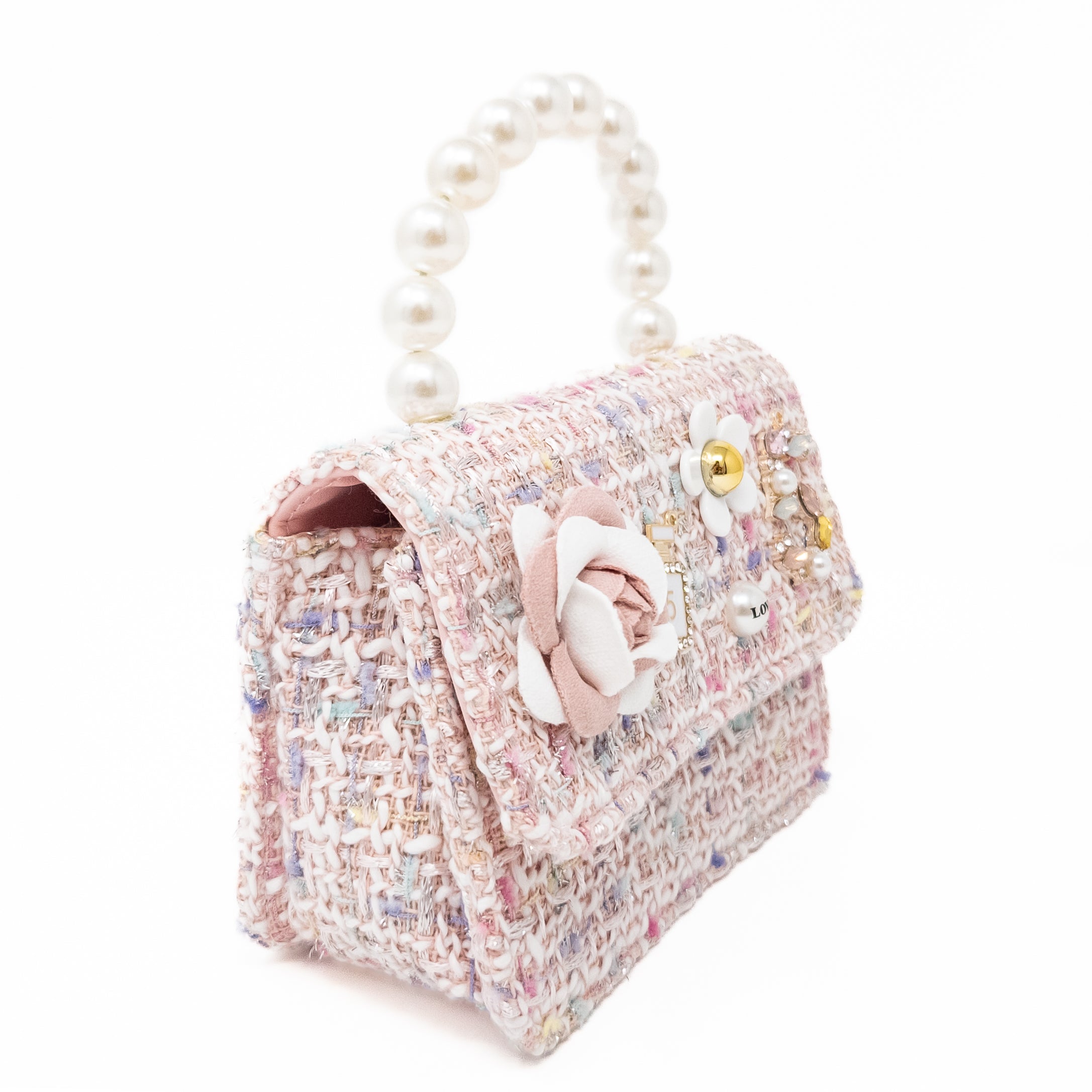 Tweed handbag with pearl handle and floral embellishments.