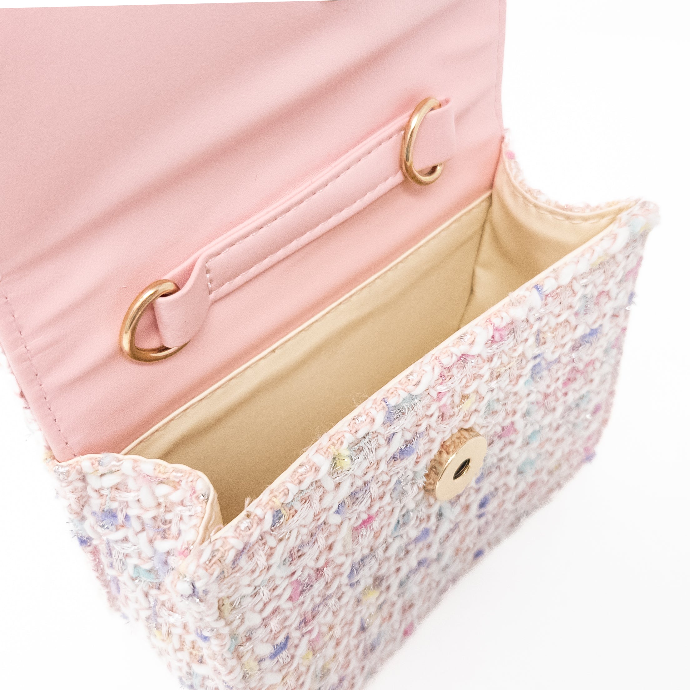 Open pink and white woven handbag.