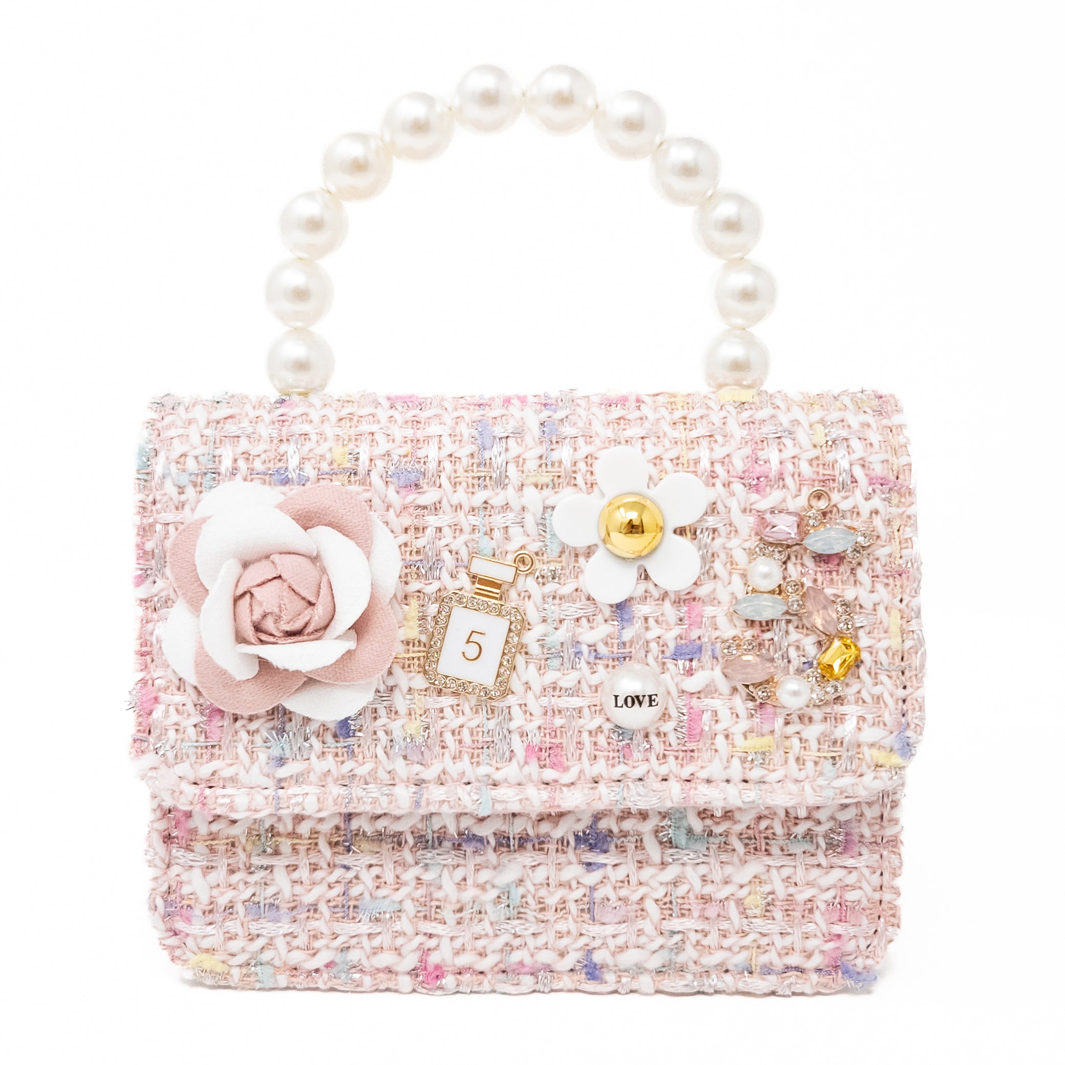Pink tweed purse with pearl handle and decorative charms.