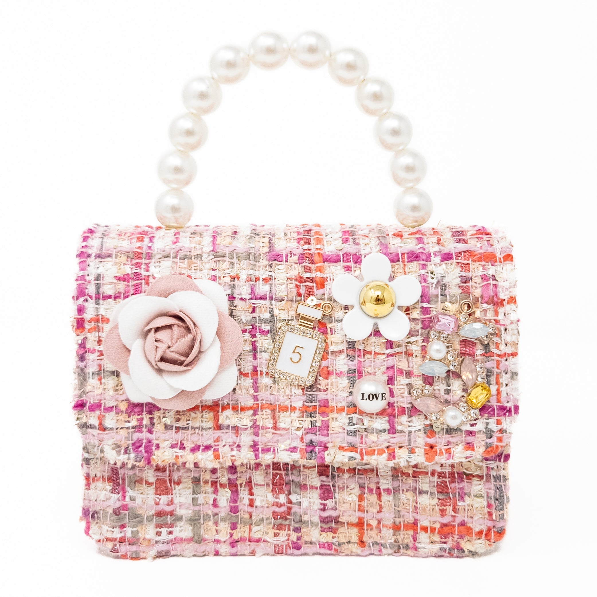 Pink tweed bag with pearl handle and floral embellishments.