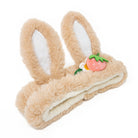 Fuzzy bunny ear headband with strawberry accent.
