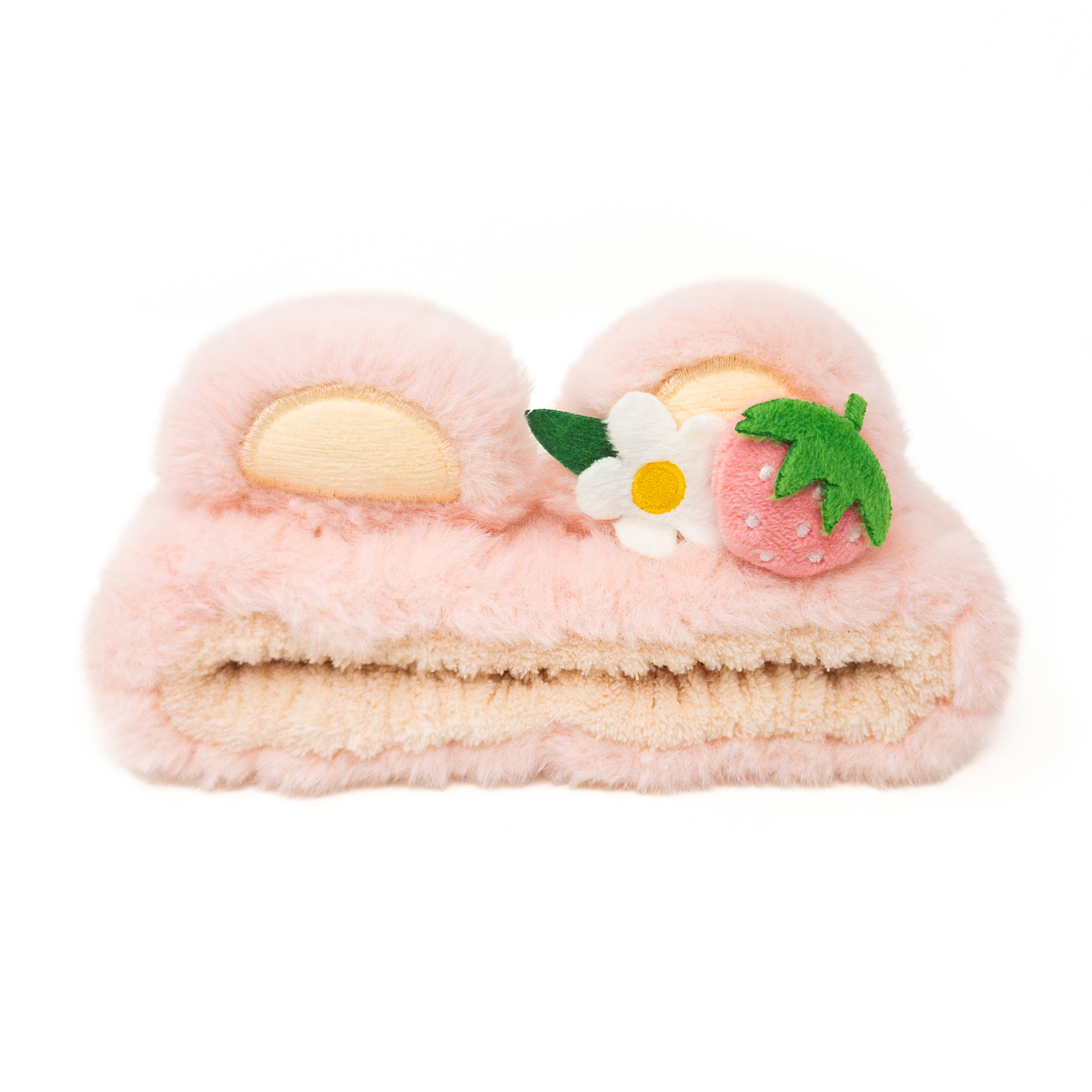 Pink plush headband with ears, a white flower, and a pink strawberry.