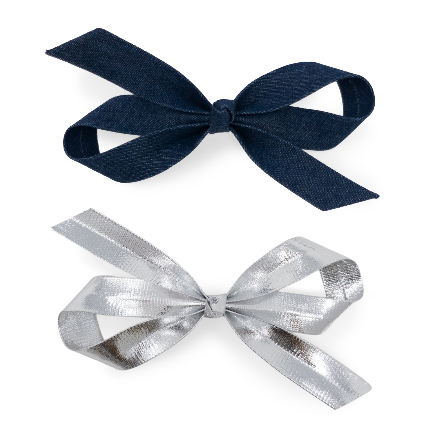 Two bow clips, one in dark blue denim and one in crinkled metallic silver.