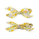 Two floral print hair clips.