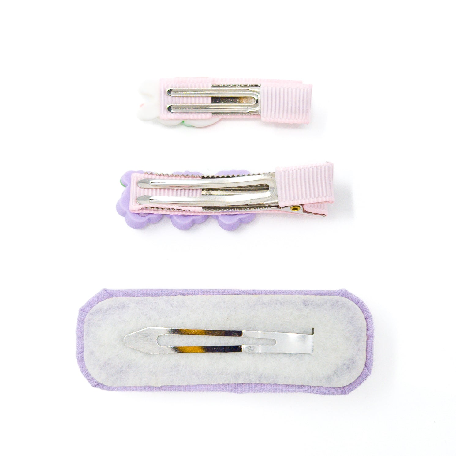 Three hair clips with silver clips.
