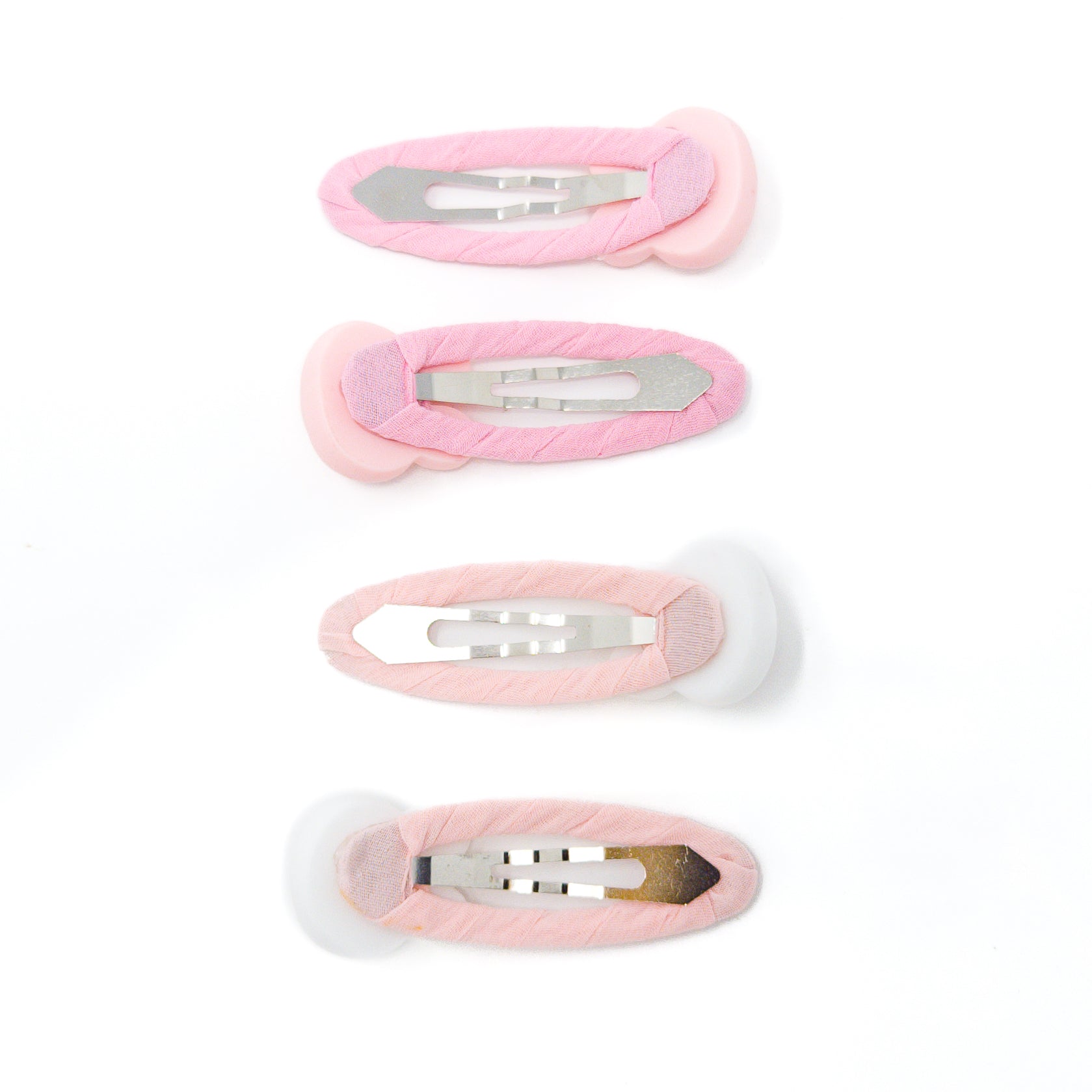 Four pink fabric-covered hair clips.
