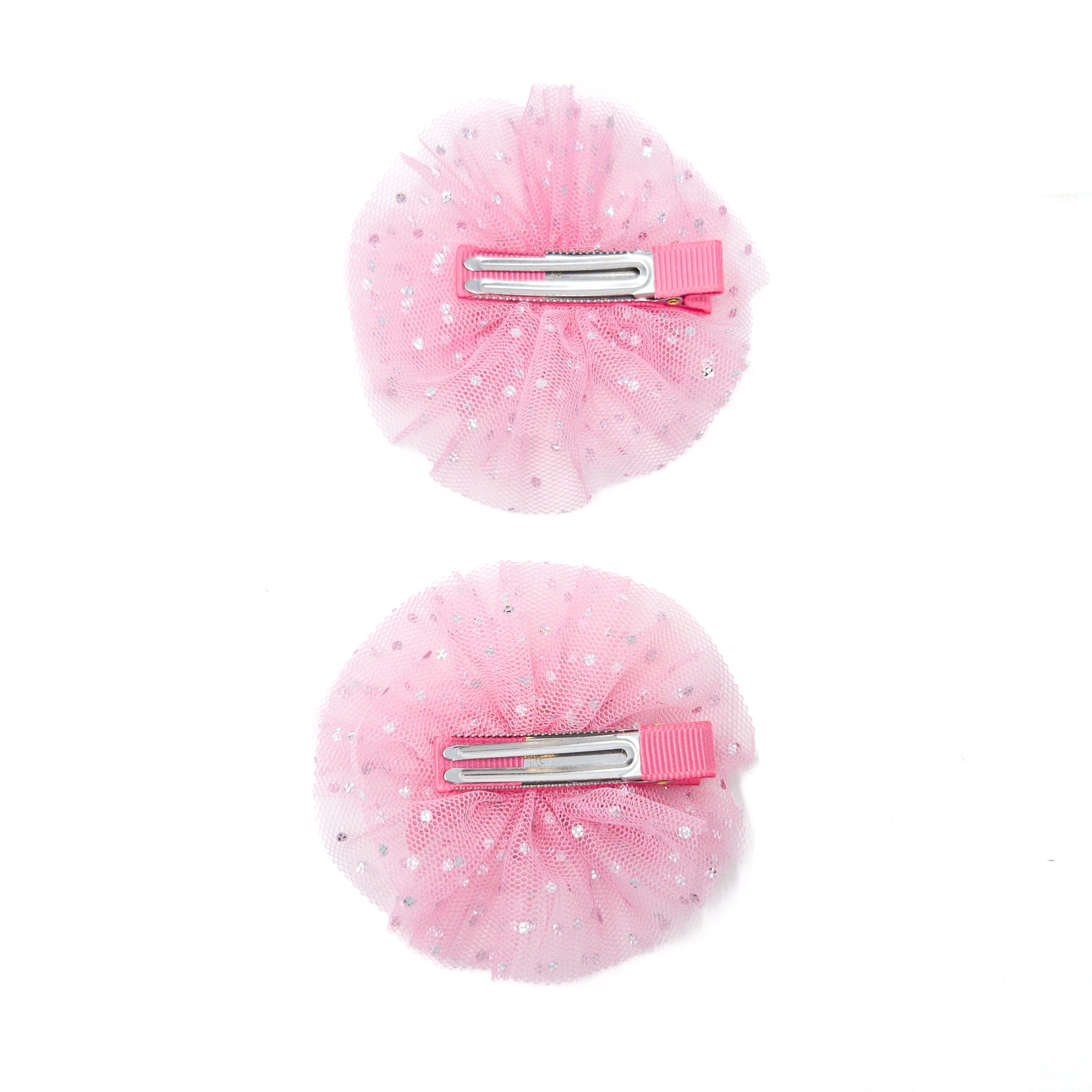 Two pink tulle hair clips with silver dots.