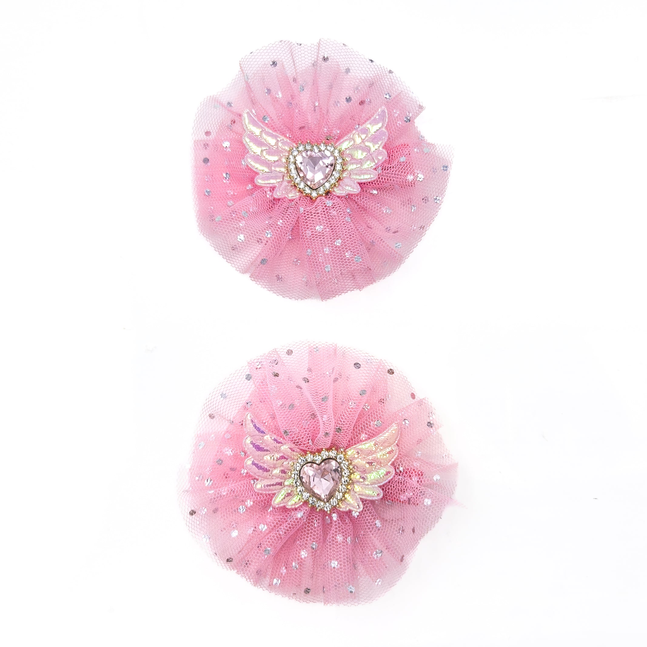 Two pink tutu hair ties with heart and wing embellishments.