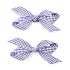 Two lavender and white checkered hair bows.