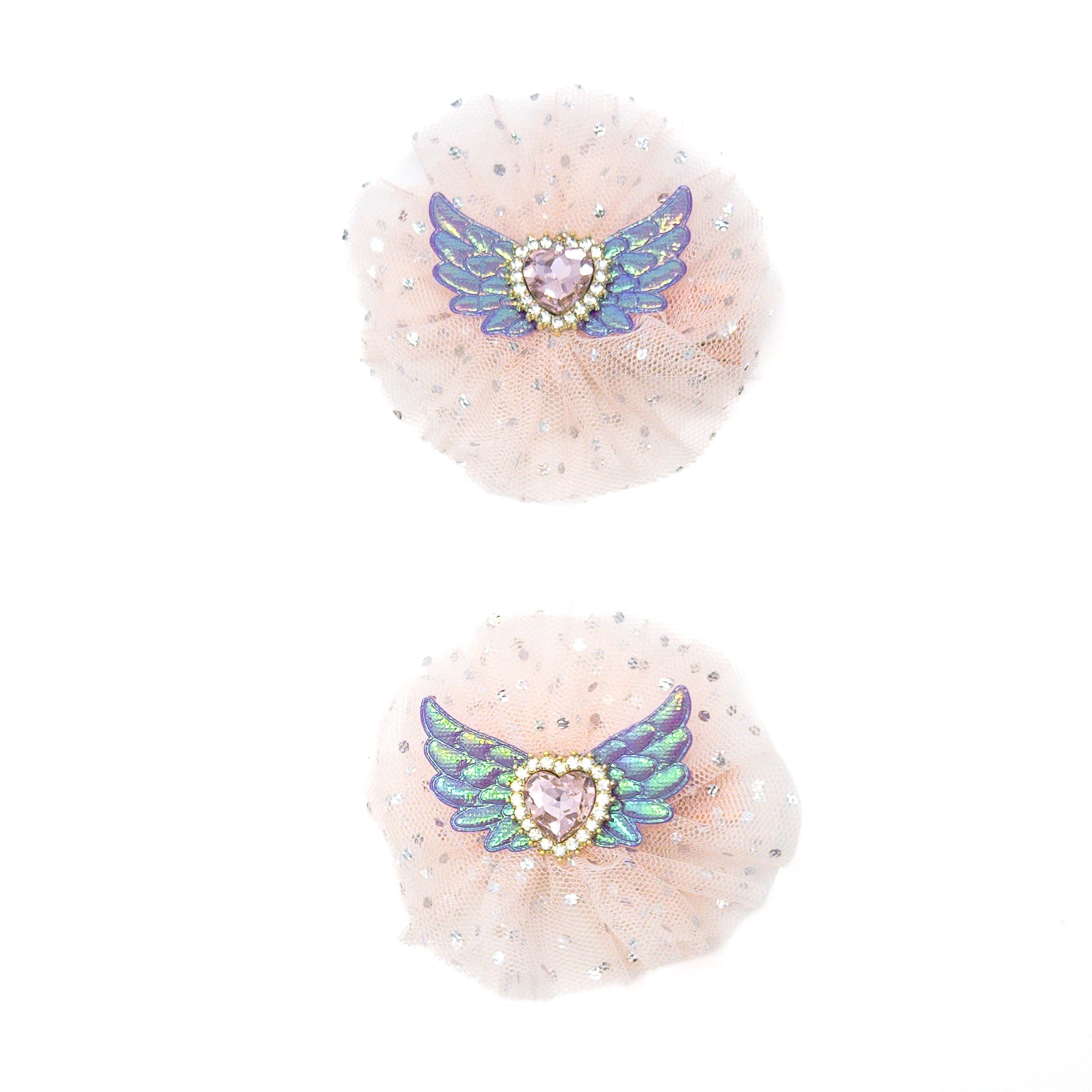 Two blush-colored tulle hair accessories with iridescent wings and heart-shaped jewels.