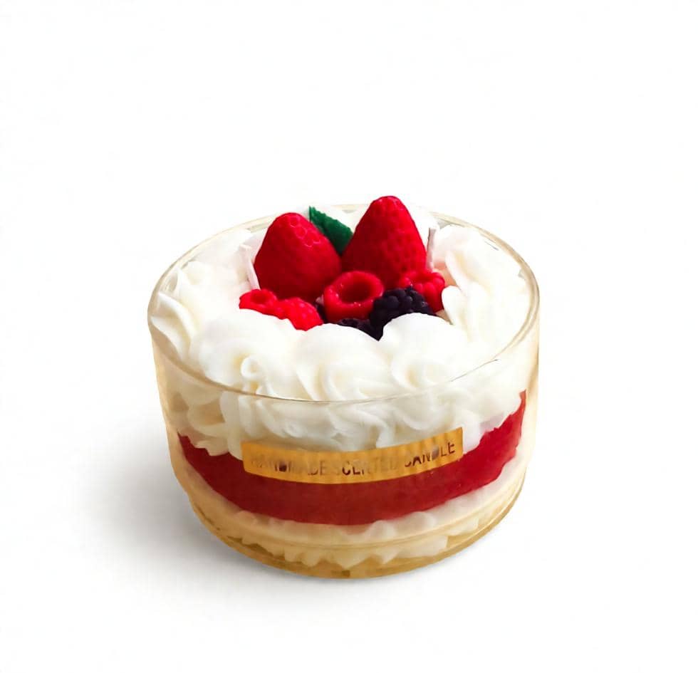Dessert with whipped cream and berries in a glass container on a white background