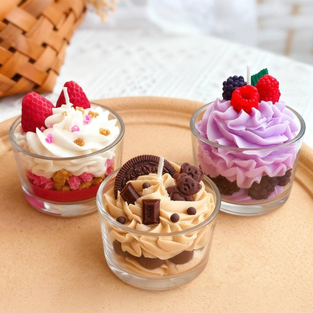 Three small dessert cups with different flavors on a beige surface.