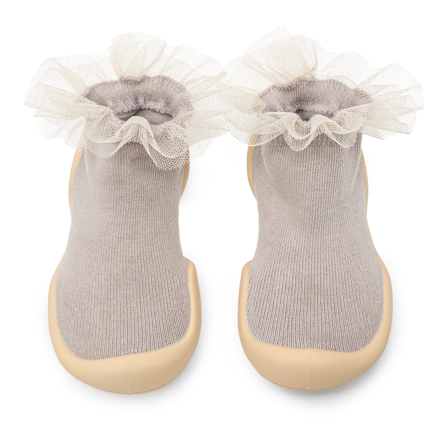 Pair of tan baby socks with ruffled lace trim.