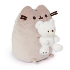 Stuffed plush cat toy holding a white teddy bear.