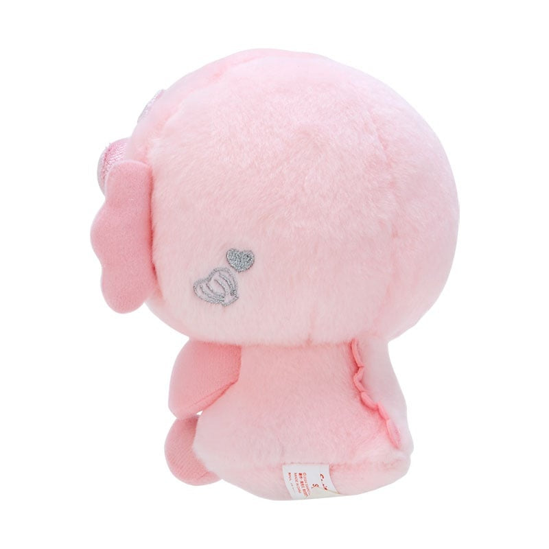 Rear view of a pink plush toy.