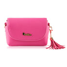 Pink faux leather crossbody bag with tassel.