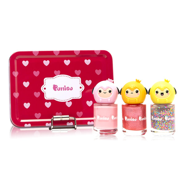 A red tin box with white hearts, and three bottles of nail polish with cute character lids.