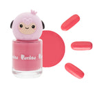 Pink nail polish with a sheep-shaped lid, surrounded by nail polish drops.