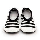 Pair of black and white striped baby shoes.
