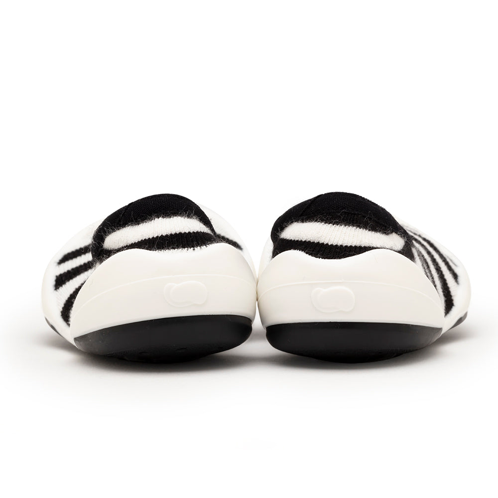 Pair of black and white striped baby shoes.