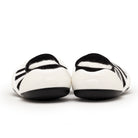Pair of black and white striped baby shoes.