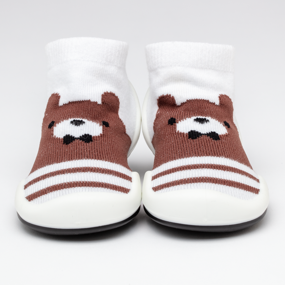 Pair of baby socks with brown bear design.