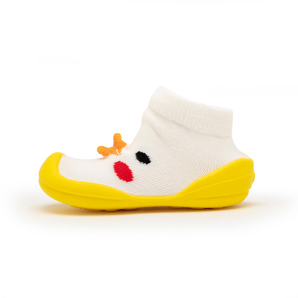 Infant sock shoe, white sock upper, yellow sole, red and black face detail, orange antennae.