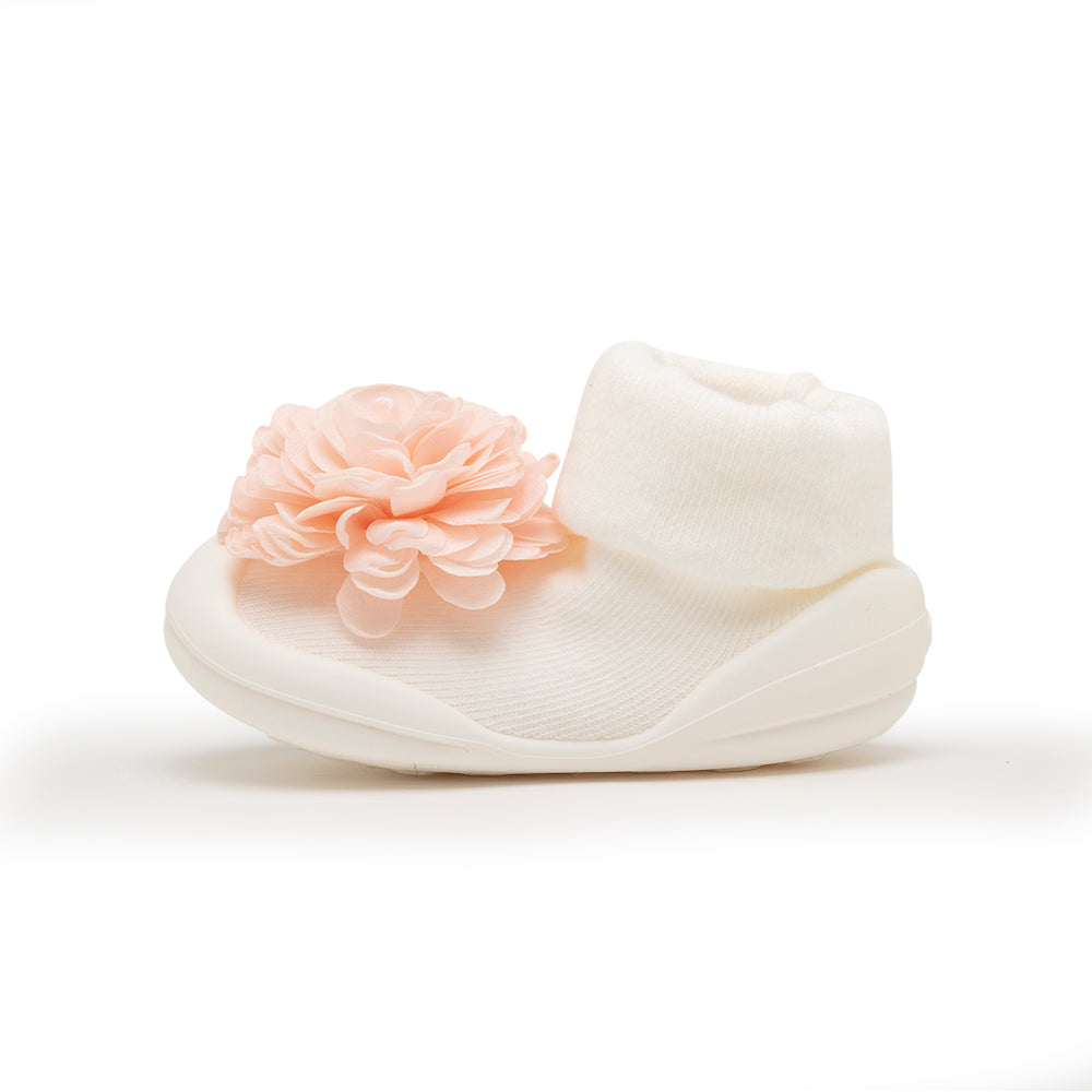 Infant sock shoe, white, with peach flower.