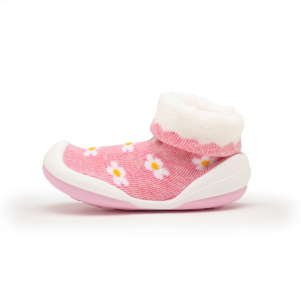 Pink sock-shoe with flower pattern.