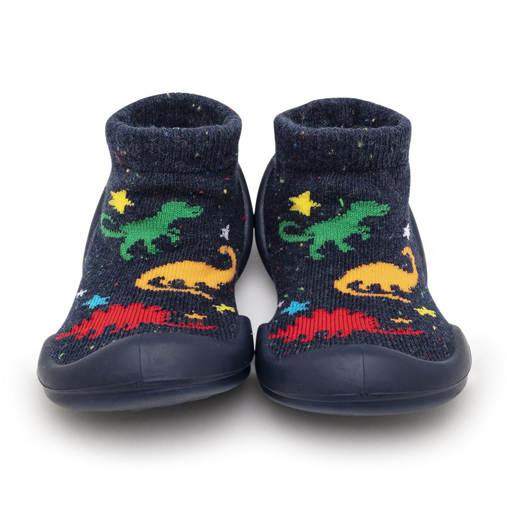 Pair of navy blue baby socks with dinosaur patterns.