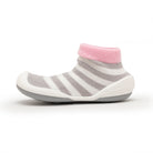 Striped baby sock shoe with pink cuff.