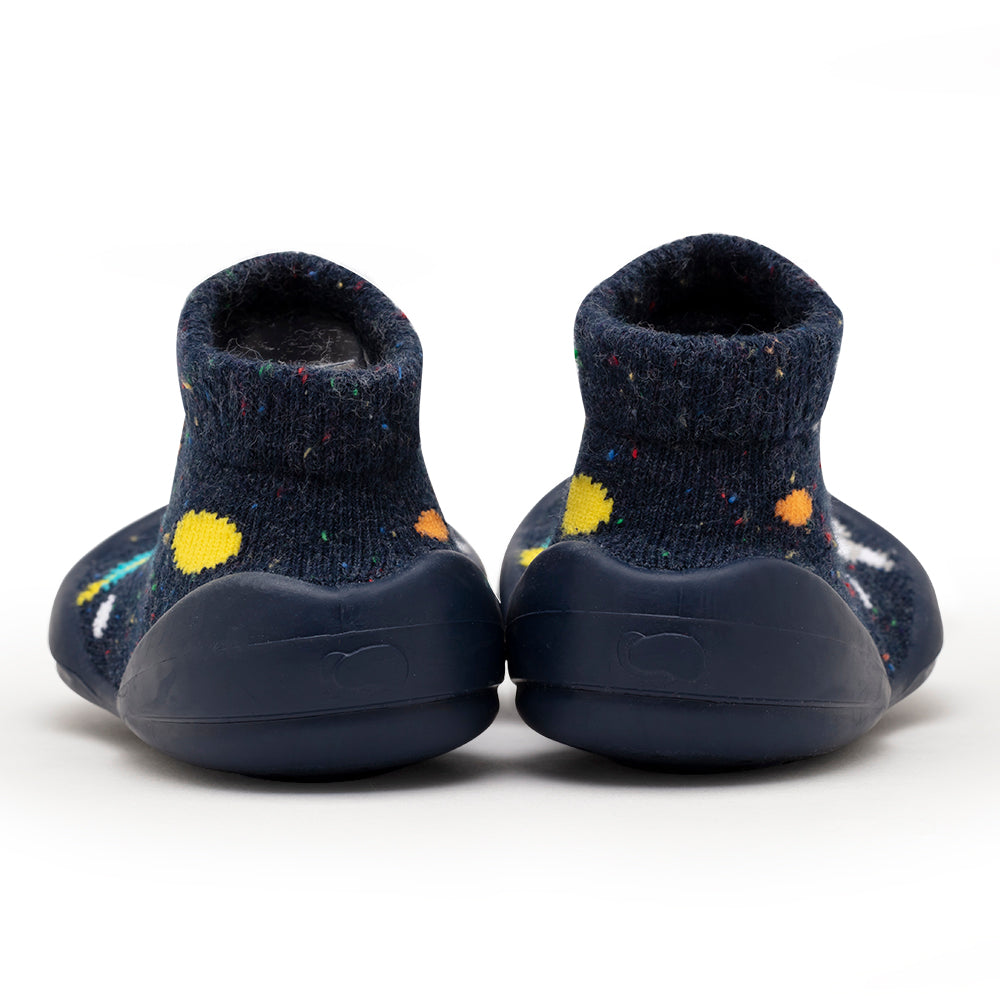 Rear view of blue baby shoes with sock-like tops.
