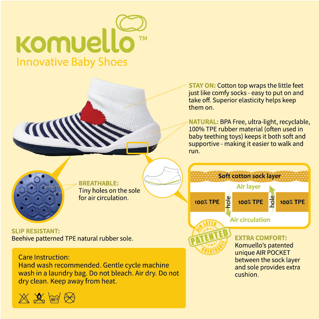 A Komuello brand baby shoe, highlighting its features like breathable holes, cotton top, and TPE rubber sole.
