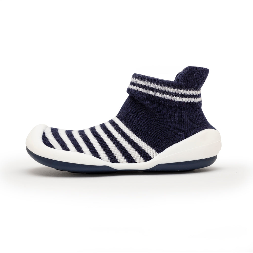 Navy blue and white striped sock shoe with white sole.