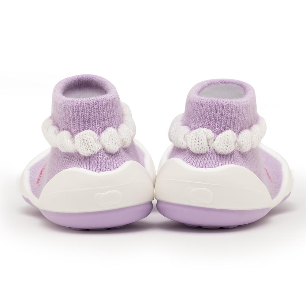Rear view of purple and white baby shoes.