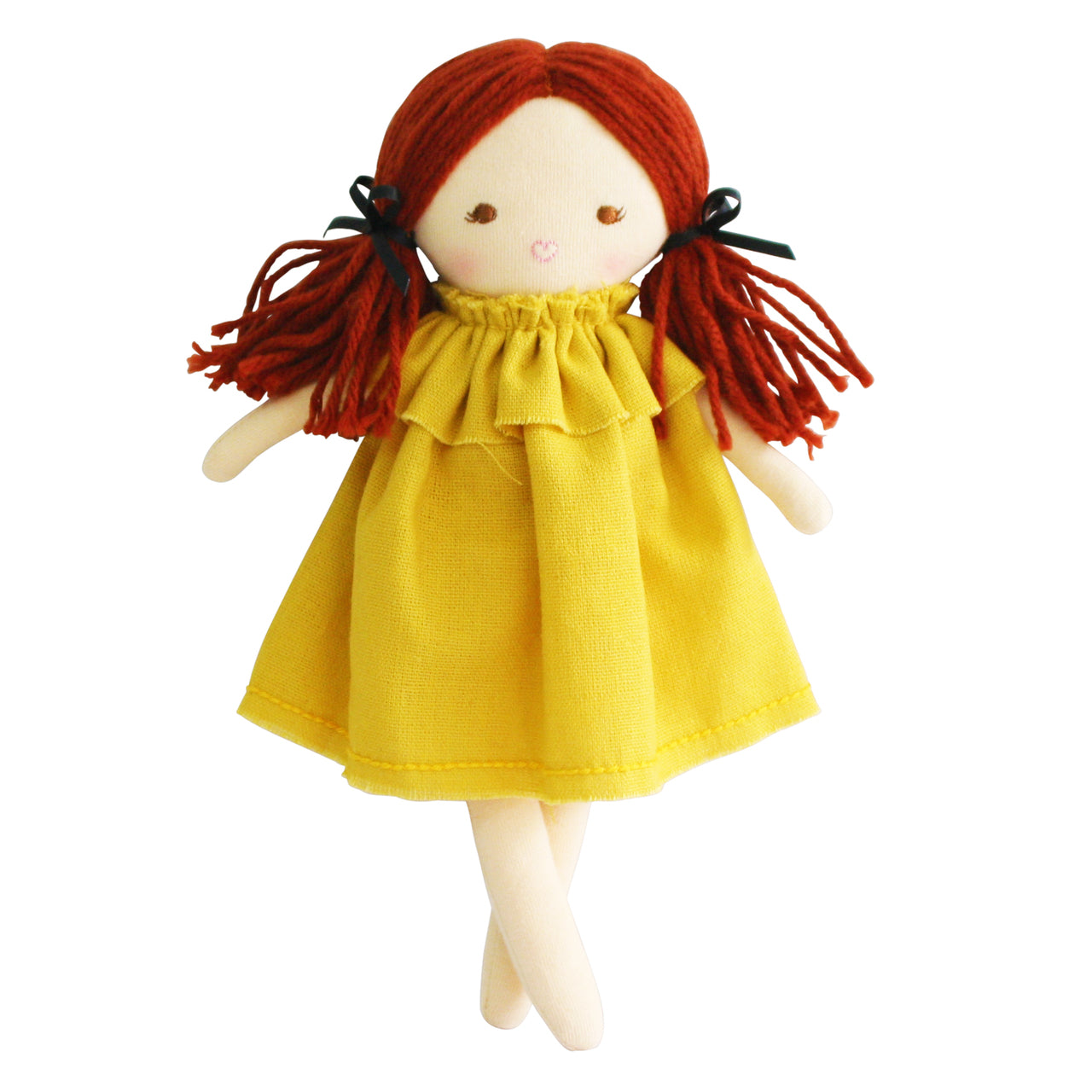 Cloth doll with red yarn hair, yellow dress, and black ribbons.