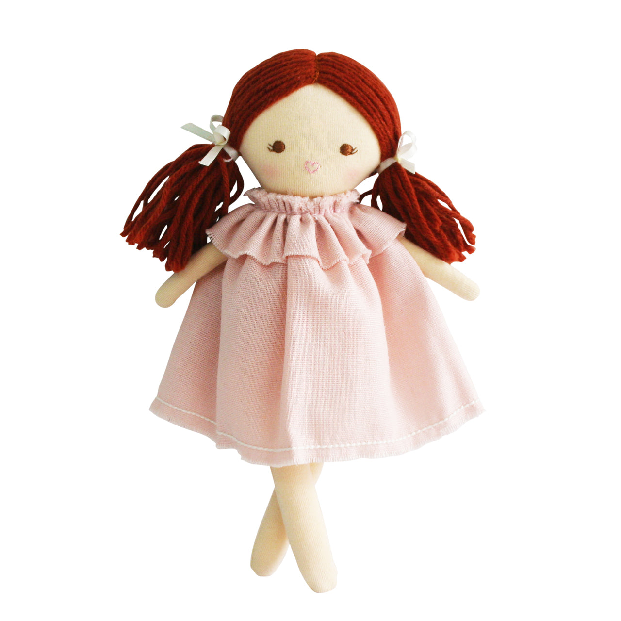 Ragdoll with red hair in pink dress standing.