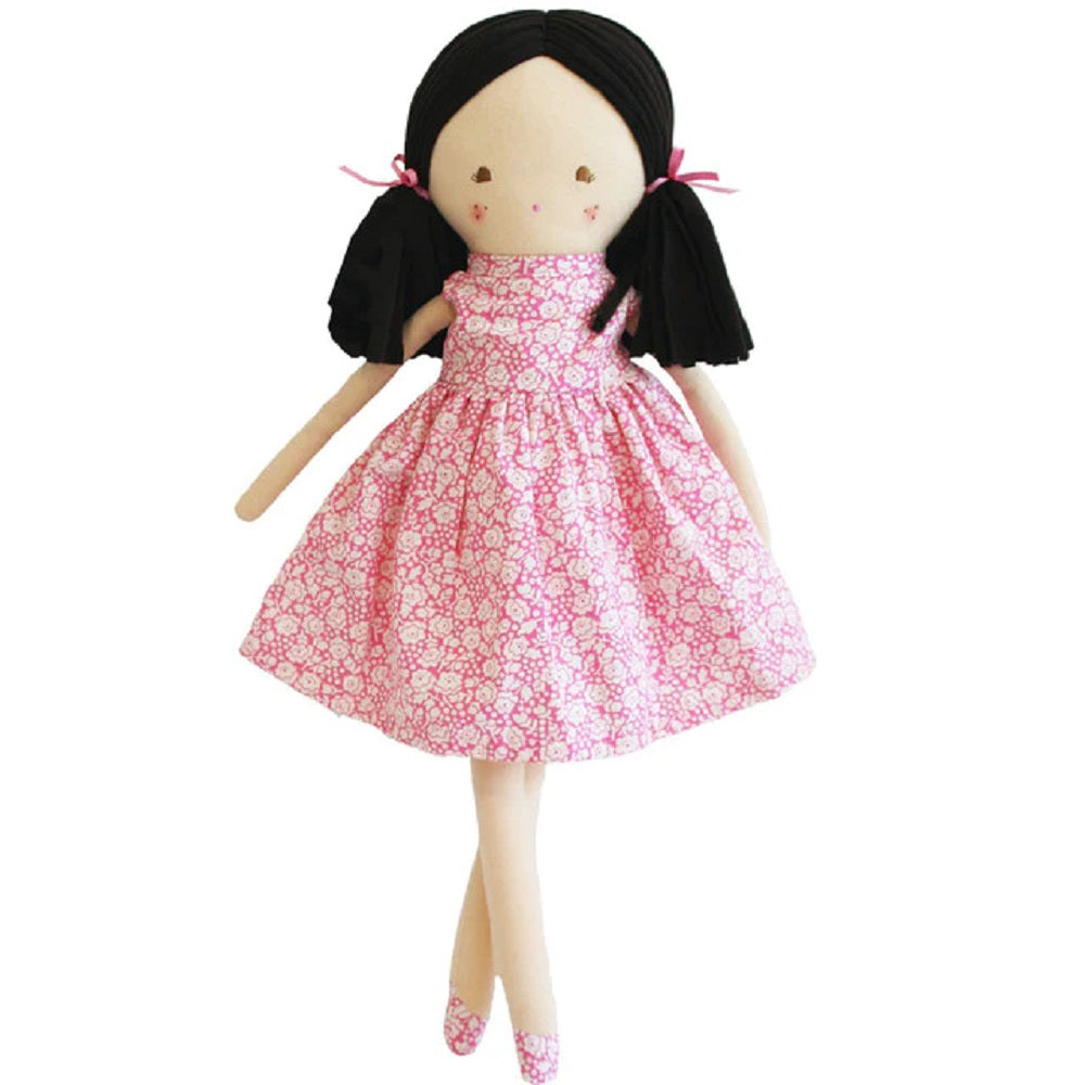 Stuffed rag doll in a pink floral dress.