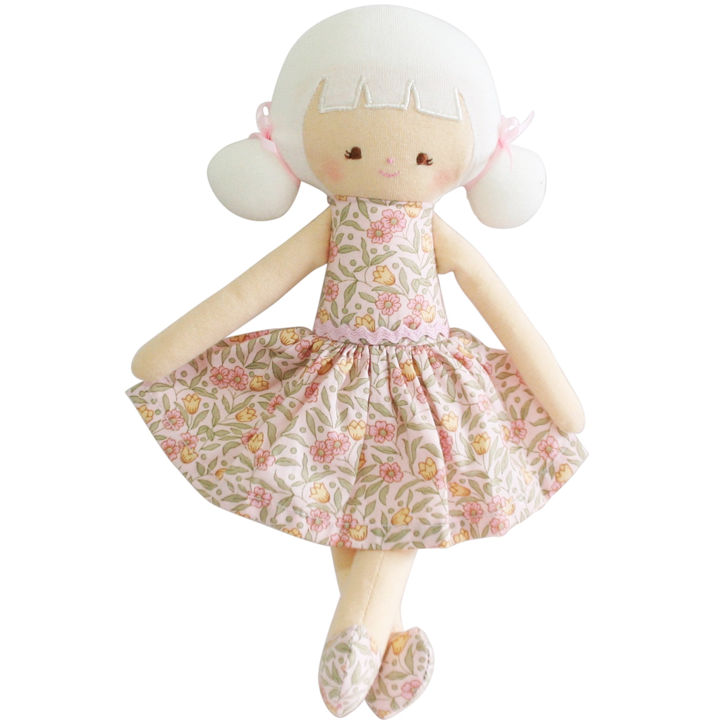 Stuffed doll wearing a pink floral dress with white hair.