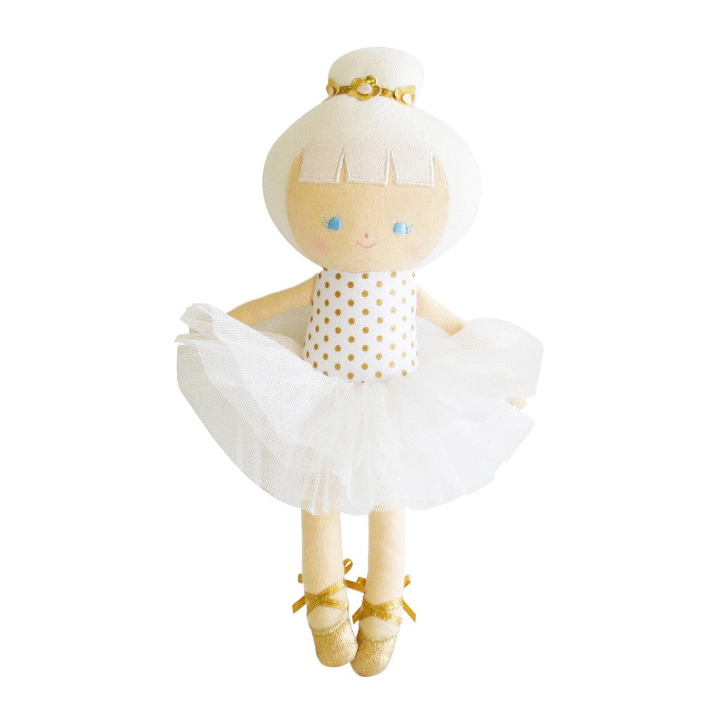Ballerina doll in white dress and gold shoes.
